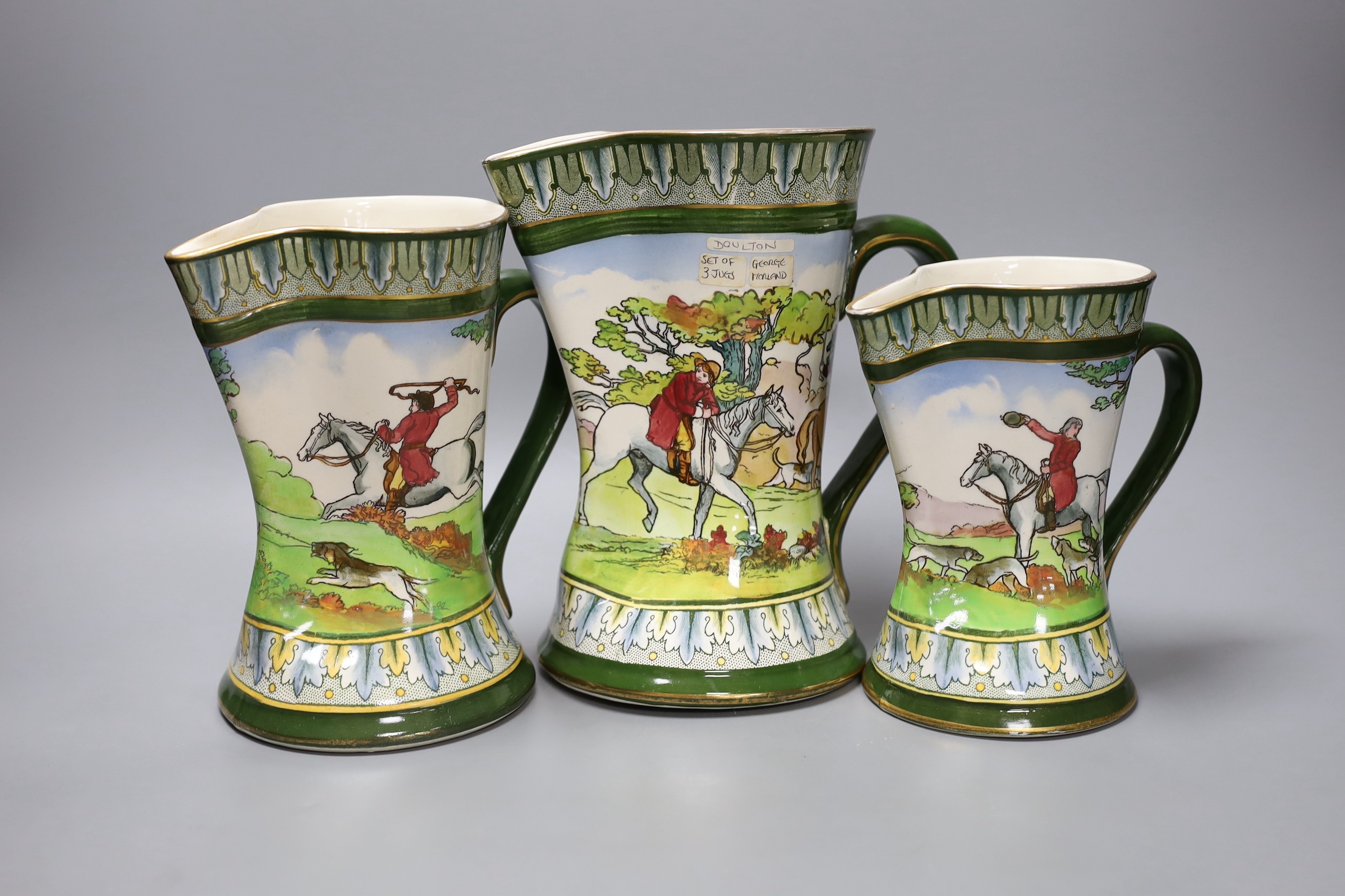 A graduated set of three Royal Doulton hunting jugs, 22cm